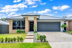  9 Carrera Cres Cooranbong NSW 2265 $880,000 to $920,000 Set against a gorgeous backdrop of bushland sits this ultra-modern, single-level executive family home on a generous 504sqm parcel. Offering spacious proportions and immaculate styling, this residence exudes space, privacy and the kind of luxurious finishes that will attract the fussiest of buyers. Boasting four generous bedrooms with living and relaxing zones in equal measure, its open floorplan invites you to float seamlessly from inside to the Grande sheltered alfresco with impressive built in BBQ and fridge, level lawns and peaceful bush vistas. Prepare sumptuous chef inspired meals in the ultra-modern kitchen, with s/s appliances, sleek island design, Stone surfaces and waterfall edges, or enjoy a theatre-at-home experience in the dedicated media room. Retreat to your own privately set master, complete with WIR and full-sized en-suite. With plenty of room for growing families, this home is close to the best schools in the area and a short drive to Morisset’s shopping precinct. – Situated in sought after peaceful green enclave and surrounded by other quality residences – All finishes have been chosen with a designers eye, with only the best of inclusions – The privately set master includes double WIR and up-to-the-minute stylish full en-suite – Family bathroom with freestanding bath and stone top vanity – Ducted air conditioning, internal laundry, double garage with internal access, level block, security cameras, crim safe doors – Minutes to Avondale School, Avondale College and local village shops – Short drive to Morisset town centre with all amenities and freeway entry. 