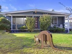  4 Fourth Ave Sandy Point VIC 3959 $750,000-800,000 Completely updated to offer the perfect low maintenance escape just two minutes stroll to Ned Neales lookout and the dog friendly end of the beach. Filled with natural light flowing out to entertaining decks on both sides of the home, the open plan living space is quick to heat and cool with the convenience of a RC/AC. Easy care timber flooring continues into the as-new kitchen with gleaming white cabinetry, electric appliances and servery to meals area. Two spacious bedrooms, central modern bathroom with stunning terrazzo tiles and upsized shower. Gently undulating block of approx. 772m2 with long northern aspect, fully fenced at the rear - side gate access for caravan or boat access, LU shed and still room for games of cricket. Established trees for shade, shelter and the visiting koalas. Being sold fully furnished and ready to go. If you are looking for an easy care getaway where you can focus on enjoying the great outdoors. 