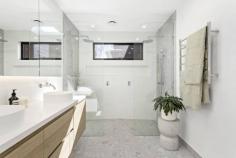  12 John St Elwood VIC 3184 $2,900,000 - $3,100,000 Sited on a double-fronted block, this builder's-own freestanding Edwardian has been superbly renovated and extended with uncompromised comfort and craftsmanship throughout its single-level design. The original façade has been retained and the interior transformed only 12 months ago into a spectacular contemporary domain perfectly attuned to modern lifestyle desires. With high ceilings carried throughout, the home's impressively proportioned floorplan showcases a show-stopping living and dining room with a luxurious amount of space, endless streams of natural light, and soaring sloped ceilings adding fantastic vertical volume. There's also a wood heater to unwind in idyllic fashion during those cooler months. Anchoring the lofty airy space is a sky-lit gourmet kitchen making it easy to indulge your culinary skills thanks to its precision functionality and the high-end inclusions of a centerpiece island bench/breakfast, white marble surfaces, Blum cabinetry, dual pyrolytic ovens, induction and gas cooktops, fridge plumbing provision, and a butler's pantry with additional sink. At the front of the home, the five-star main bedroom offers a private retreat with a window seat and a walk-through robe to a sensational ensuite bathroom with double shower and twin vanities. Three additional bedrooms are serviced by an equally stylish family bathroom with bathtub and shower. A peaceful north-facing deck and rear garden offer exceptional alfresco entertaining and relaxation complemented by the rustic brick and black cladding adorning the rear façade. The residence also benefits from a fitted home office which can be closed off for working without distraction, a full laundry room, 16kw ducted reverse-cycle heating and cooling, floor heating in the two bathrooms, extensive 8 x3 m plastered roof storage, top-of-the-range 6mm European Oak floorboards, high-quality wool carpets, Franke tapware, CCTV security, built-in speakers indoors and out, and prized off-street parking for two cars. Giving it a 'brand-new edge, the home has also been rewired, replumbed and reinsulated and fitted with a new sewer, storm water and roof. Stroll in any direction to find a fantastic selection of lifestyle amenities, including Elwood Primary and College, St Columba's Primary School, Brighton Road trams, Tennyson Village, Ripponlea Village and Station, Elsternwick Park, St Kilda Botanical Gardens, and Elwood Beach. 