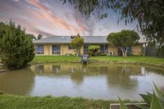  10 Girdwoods Rd Tarraville VIC 3971 If you're looking for peace and quiet just 4 minutes from boat launching, this is sure to appeal. Set on approx. 12.8 acres of fertile, flat and well fenced land with unlimited water from the bore, sealed road access and views to the distant hills. Sandstone residence sited to capture the warm northerly aspect and outlook over feature dam with jetty, filled with natural light and luxuriously appointed. Stunning kitchen with gleaming cabinetry, modern appliances and granite look breakfast bar to light filled dining area. Separate spacious living room. 3 large fitted bedrooms, master with walk in robe and ensuite bathroom. Family bathroom, separate w.c and fitted laundry. Quality soft furnishings, ducted vacuum, zoned RC/AC and ceiling fans, solar and mains power, double auto garage. Outside is sure to delight with so much shedding - 18 x 9 x 4.5m with mezzanine, power, lights and water giving space to store the boat plus workshop space. Adjoining annexe for caravan or float. Chook pen, hot house, fenced orchard, vegetable gardens, cattle race, abundant water storage. Quiet location just 100m from the Tarra River, 8 mins from Yarram, 4 mins from the historic fishing village of Port Albert. Come and discover the good like in this picturesque location. 