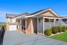  50 Kalang Road Kiama Heights NSW 2533 $1,995,000 - $2,100,000 Perched up high with breathtaking views over 'Loves Bay' and rural rolling hills lies this well maintained and modernised family home. Solidly built and having had just the one owner, this property enjoys plenty of natural light and an outlook most people dream of. Idyllically located in the Kiama Heights enclave this home is situated between the pristine 'Easts' beach & 'Loves' bay, coastal walking tracks and headland reserve, offering the coastal lifestyle change you have been dreaming of. This substantial home comprises of 5 bedrooms, master with ensuite and walk-in robe, 3 bathrooms, 2 separate living areas, impressive modern quality kitchen, drive-thru garage and large entertainment deck flowing effortlessly from the main upstairs living area. Additional features include fantastic storage, room in the garage for a workshop, above ground pool, 6.6kw solar panel, 2 x water tanks, split system a/c and potential to create self-contained flat with downstairs bedroom. Situated on an expansive 797sqm block with established gardens and surrounds, there is a feeling of space and plenty of room to grow your own vegetables or yard for the kids to run around. With this home already modernised throughout and a spacious entertainment deck off the main living room taking full advantage of the stunning coastal line, there will be plenty of time to entertain friends/family or sit back and enjoy vista. 