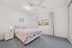  9 Merrett Gardens Gordon ACT 2906 This property will be going to auction on Saturday, 10th September as apart of our Spring Selection Event. All auctions will be held in the Ray White Canberra Auction Room - 2/14 Wales Street, Belconnen. Please note exact auction times will be released closer to the event. Lovingly renovated and extended over a single level, with clever consideration for the modern lifestyle this four bedroom home with formal and informal living rooms, together with a large rumpus is one for the growing or established family. From the leafy street frontage, the charm of the 885sqm block begins. Established gardens surround and shade the home, making entertaining a delight in the spacious covered outdoor area. At the entry to the home, your interest is instantly drawn to a light and bright north facing living room and vast open space as the inside and outside become one through large framed windows. The earthly kitchen is the centrepiece of the home and is complimented by Tasmanian Oak floorboards which flow seamlessly throughout. Incorporating an electric oven and gas cooktop the kitchen includes an abundance of storage, built-in pantry, bench space and display cabinets. Each of the bedrooms are generous in size and most include built-in wardrobes. The segregated master bedroom is at the front of the home and is complete with a private ensuite and built-in robes. The household washing can be sorted from within the separate laundry and can be accessed from the external entry. Additional storage space is provided by the linen closet and cloak cupboard. The large covered outdoor entertaining area doubles as an ideal location to bask in the morning sun or a protected place to bring all your family and friends together for a BBQ while the children and pets explore the expansive manicured garden. A double garage with remote access ensures the covered transfer in all weather conditions and an additional open-air parking space ensures plenty of off-street parking. Adjacent to parklands and ponds, walking and riding trails and close to public transportation, schools and shops; the home is certain to not last long.  Additional features Include; Overlooking parklands and ponds Ducted gas heating and evaporative cooling Gas cooktop, electric oven, dishwasher Formal lounge, dining, family and rumpus/multipurpose room Master bedroom with ensuite and robes Exceptionally large fourth bedroom Built-in wardrobes for three Large covered outdoor entertaining area Double garage with remote access Single and double glazed windows Rates $3,551.14pa, Land tax $5,824.40pa (if rented) Living 202sqm, Block 885sqm 