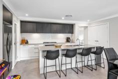  9 Carrera Cres Cooranbong NSW 2265 $880,000 to $920,000 Set against a gorgeous backdrop of bushland sits this ultra-modern, single-level executive family home on a generous 504sqm parcel. Offering spacious proportions and immaculate styling, this residence exudes space, privacy and the kind of luxurious finishes that will attract the fussiest of buyers. Boasting four generous bedrooms with living and relaxing zones in equal measure, its open floorplan invites you to float seamlessly from inside to the Grande sheltered alfresco with impressive built in BBQ and fridge, level lawns and peaceful bush vistas. Prepare sumptuous chef inspired meals in the ultra-modern kitchen, with s/s appliances, sleek island design, Stone surfaces and waterfall edges, or enjoy a theatre-at-home experience in the dedicated media room. Retreat to your own privately set master, complete with WIR and full-sized en-suite. With plenty of room for growing families, this home is close to the best schools in the area and a short drive to Morisset’s shopping precinct. – Situated in sought after peaceful green enclave and surrounded by other quality residences – All finishes have been chosen with a designers eye, with only the best of inclusions – The privately set master includes double WIR and up-to-the-minute stylish full en-suite – Family bathroom with freestanding bath and stone top vanity – Ducted air conditioning, internal laundry, double garage with internal access, level block, security cameras, crim safe doors – Minutes to Avondale School, Avondale College and local village shops – Short drive to Morisset town centre with all amenities and freeway entry. 