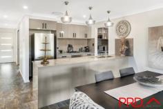  32 Jubata Drive Tamworth NSW 2340 $749,000 Located in the sort after Moore Creek Gardens Estate, amongst beautiful new and established quality built homes, this four bedroom home has been designed for all seasons and designed to connect with the outdoors. As you enter the family home the warmth and appeal that has been created is evident in every corner. The theatre room as you enter is inviting, perfect for some quiet time or to enjoy a movie OR 4th bedroom. The long, wide hallways takes you through to the open plan kitchen, dining and family are all spacious light and family friendly. The kitchen is stunning, a gorgeous charcoal, black and grey colour palette with beautiful stone tops. Very practical and includes fabulous preparation and bench space , gas cooktop and plenty of storage and space with a butlers kitchen that you will love. The expansive master bedroom includes walk in robe and en-suite. The other three bedroom are all good sizes with built in robes and the main bathroom is light and functional with touches of colour and texture all in statement grey tones that won't date. The double garage includes remote access and internal access to the home via the laundry and butlers kitchen. If entertaining is your thing then you will love to escape to this backyard. Covered for year round enjoyment, plenty of space for lounging and dining. Create a BBQ and fire pit area for those cosy winter camp fires, add a swimming pool and large shed and you have got your lifestyle sorted. Power is in the ground for the shed to be erected PLUS no neighbours at the back, just hills and a rural setting. The large yard is 2047m2 and with some trees, turf and landscaping 32 Jubata Drive will be your paradise to call home. Put you own stamp on the design. The build was completed in 2022, has ducted reverse cycle zoned air conditioning and is only minutes to town, close to Calrossy and McCarthy Catholic College, Supermarket and so much more. 