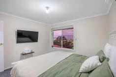  2/10 Badden Court Glenorchy TAS 7010 $595,000 Start, invest or empty-nest, and idle the days away within this unbeatable restful location! Set within a boutique few with no strata and situated for sun-bathed kunanyi views, this 3-bedroom home captures a soothing essence over two generous levels, providing the opportunity to live or invest with endless all-day sun and a tightly-held address. Styled with neutral tones and polished up with laminate floorboards and plush carpets, this sun-filled home sparkles with well-defined lounge and dining areas on the first floor and generous bedrooms, including two with robes. Orientated to entertain within the open meals and alfresco deck, the well-appointed kitchen boasts ample bench space and storage, a dishwasher and an electric stove, whilst a reverse-cycle heat pump creates a comfortable atmosphere year-round. With a full-width storage room, a huge laundry, external shutters, a bright family bathroom with a deep bath and easy parking for two, including a single garage, it's an idyllic low-maintenance getaway with all the modern perks! Secure, stylish and stretched out in the sun, there's nothing to do here but enjoy the generous backyard and fabulous location, just a short drive from Northgate Shopping Centre, cafes, restaurants, buses and the spoils of the riverfront. 