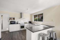  2/10 Badden Court Glenorchy TAS 7010 $595,000 Start, invest or empty-nest, and idle the days away within this unbeatable restful location! Set within a boutique few with no strata and situated for sun-bathed kunanyi views, this 3-bedroom home captures a soothing essence over two generous levels, providing the opportunity to live or invest with endless all-day sun and a tightly-held address. Styled with neutral tones and polished up with laminate floorboards and plush carpets, this sun-filled home sparkles with well-defined lounge and dining areas on the first floor and generous bedrooms, including two with robes. Orientated to entertain within the open meals and alfresco deck, the well-appointed kitchen boasts ample bench space and storage, a dishwasher and an electric stove, whilst a reverse-cycle heat pump creates a comfortable atmosphere year-round. With a full-width storage room, a huge laundry, external shutters, a bright family bathroom with a deep bath and easy parking for two, including a single garage, it's an idyllic low-maintenance getaway with all the modern perks! Secure, stylish and stretched out in the sun, there's nothing to do here but enjoy the generous backyard and fabulous location, just a short drive from Northgate Shopping Centre, cafes, restaurants, buses and the spoils of the riverfront. 