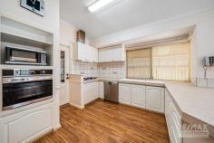  63 Balladong Loop Carramar WA 6031 $599,000 If you have been searching for a property with space for the cars, boat, caravan & toys, that has full drive through access to undercover parking & a huge, powered brick-built garage / workshop, this is it! Features & benefits include: *     Entrance hall *     Formal lounge / dining *     Master bedroom with walk in robe, split system air conditioning & ensuite with vanity, shower & WC *     Open plan family & meals areas *     Kitchen with stainless steel oven & dishwasher, 900mm gas cook top, microwave recess, pantry, and shoppers’ access from the garage *     Games room *     2 further spacious bedrooms with built robes *     Family bathroom with vanity, bath & shower *     2nd WC *     Laundry *     Walk in linen cupboard *     Utility Room *     Ducted air conditioning *     Ducted gas heating *     Skirting boards *     Security screens *     Large, undercover entertainment area with drive through access *     Huge, powered, brick workshop with remote roller door (potential to convert into a granny flat / studio / work from home space) *     Double, remote garage with rear drive through access to workshop *     Large 670sqm block *     Close to schools, shops, parks, transport & all other local amenities 