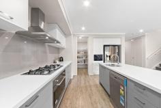  24 Dolomites Dr. Truganina VIC 3029 $730,000 - $760,000 This stunning 4 bedroom family home features spacious living areas including an upstairs parents retreat. The master bedroom has a walk in robe and spacious ensuite. An additional 3 bedrooms, all with built in robes, share a luxurious central bathroom. Downstairs living spaces open up to rear courtyard ideal for alfresco dining. Other features include a large kitchen with plenty of storage, double garage and ducted heating and cooling throughout. 