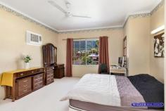  36 Barnes Street Earlville QLD 4870 $1,500,000 Situated at the top of Barnes Street, 3 metres above street level is this stunning two-storey, solid block home on a generous, flat 1056m2 block. This is an executive home with lots of space with 3 bed 2 bath (with spa bath), sunroom, upstairs sitting room leading out onto a large, aluminium deck looking over the spectacular views of Cairns. Downstairs is large entry leading to a sunken lounge and living room, internal laundry, second bathroom, storage room, 2 car garage and large rear patio. Outside you have flat grassed area with well established gardens and paved area. To the rear of the property there is a beautiful, sparkling in-ground pool with a whopping 50,000 litre capacity and a picturesque rock waterfall. Again the views from are just stunning. There is a 200m2 flat sports area just perfect for the kids and pets to play safely and securely. Features: • 4.5kw solar with German invertor • City views and mountain views 360 views • Built-in-robes in bedrooms with full length mirrors • Tiled downstairs • Security screens all windows and doors • 50,00 litre pool with rock waterfall • Large, paved driveway • Landscaped gardens with Buddha feature • Generous sized 1056m2 block including 200m2 flat sports area • Large aluminium deck looking over Cairns 