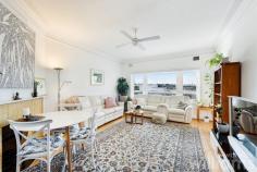  2/20 Wolseley St Drummoyne NSW 2047 Peaceful and welcoming, this elegant two-bedroom apartment in a refined Art Deco building blends classic style with light-filled living spaces and an easy-care layout. Conveniently located on the ground floor, which enjoys direct access to a leafy courtyard, while its elevated position delivers district views. Beautifully presented heritage features, such as high ceilings, picture rails and timber floors, are complemented by thoughtful modern upgrades, including air conditioning and carpeting in bedrooms. In addition to the spacious guest bedroom is a king-sized master featuring built-in robe and adjoining sunroom with a bright north-east outlook. Ideally situated for easy access to the CBD and bayside recreation, only 350m to ferry and bus routes, 600m to Five Dock Bay Esplanade. • Charming two-bedroom apartment in a quiet, east Drummoyne complex • Sunlit lounge featuring tiled fireplace, wide windows, and district views • Full-sized gas kitchen with plenty of storage, subway tiling, and Bosch dishwasher • Modern bathroom featuring designer vanity and combined shower/bath • Expansive master with dual built-in robe, air con and ceiling fan • Large sunroom with potential use as home office, art studio, or study • Double guest room including built-in robe, air con and ceiling fan • Internal laundry offers room for washer, dryer, and storage • Single space lock-up garage with additional storage space 