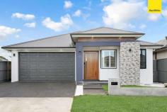  3 Satinwood Street Marsden Park NSW 2765 Architecturally Designed this spacious single-storey home is an entertainer's dream on 413sqm. sitting on a high side of the street designed east facing with sleek contemporary aesthetics which is ultra-modern in concept and warmly inviting. * Spacious wide entry foyer via large double doors * Massive light filled open plan dining & living zone. * Additional living space with gas fireplace * Sleek & stylish kitchen features large island bench with 60mm Caesarstone tops and waterfall edging, quality stainless steel appliances, gas cooking, dishwasher and built-in microwave oven. * Generous study / home office * Huge master suite comprises of large walk-in robe and palatial ensuite with freestanding bathtub and double vanity * Second luxurious master suite boasts walk in robe and a plush ensuite * Modern family bathroom with freestanding bathtub with toilet * Automatic double lock up garage with internal access, and Fully tiled. * Four indulgent bedrooms with walk-in robes, two ensuites * 3 ultra modern bathroom with stone-top vanity, bath and shower * multi-zone ducted air-conditioning ensure this home sets a benchmark for comfort, style and conscience. * Open plan Family area * Down-lights throughout the home * Huge, secure back yard, fully landscaped with uplighting * outdoor gas cooking with Alfresco area * Outdoor remote control blinds. * Big solar panels installed. Short Drive to Business Park - Costco, Ikea, Bunnings Walking Distance to Lake & playing fields Short distance to St Luke's Catholic School 