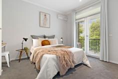  129 Westbourne Rd Kensington VIC 3031 $960,000 - $1,050,000 Showcased over three levels, this three bedroom two bathroom home has been fully updated to the pinnacle of quality, convenience and comfort. With parkland at the front door, tall trees providing shade and ringed by community greenspace, this immaculate residence is handy to everything cosmopolitan Kensington has to offer. The ground floor shines with engineered timber flooring, Daikin inverter and open plan design with glass sliding doors to the private courtyard featuring vertical garden and BBQ gas connection. The kitchen boasts Bosch appliances and a stone top waterfall island bench. Upstairs finds a luxurious main bedroom with walk-in robe and ensuite with freestanding bath and frameless walk-in rain shower. A second large bedroom has BIRs and an elongated balcony, with the top level hosting a third bedroom with a study nook offering expansive views. The central bathroom is fully tiled and contains a modern vessel sink, while a separate and sizeable home office sits alongside the single garage with automatic entry. Other quality inclusions are a downstairs powder room, under stair and roof storage, European laundry, WIFI controlled ducted heating, air conditioning units in all the bedrooms, Rinnai instantaneous hot water, quality window treatments and plush carpets. 