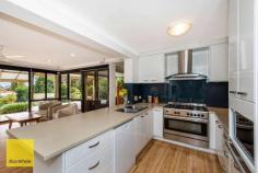  8 Scenic Drive Maida Vale WA 6057 $790,000 - $860,000 An amazing property awaits you! Transformed from its humble beginnings and located in a premiere dress circle location this property definitely ticks a lot of boxes and you will definitely fall in love. Featuring 4 bedrooms , 2 bathrooms with a 3rd w/c plus a study, two generous living areas and a convertible floorplan that features two kitchens (one upstairs and one downstairs) ideal for the extended or multi generational family - The home will suit entertainers with its amazing living space both indoors and out. Inside - Off the centrally located kitchen (with a 900m oven / range and dishwasher) is a generous living area that observes the outdoor space via large framed glass windows, letting plenty of light into the home but also providing a vista of the beautiful landscaped rear garden and sunken pool, it is easy enough via this area to get to the full outdoor area which is extremely generous and ideally set up pool side for entertaining and as far as keeping an eye on the kids in the garden and the pool - its ideal. The ground level accomodation consists of 2 bedrooms and a study (easy 5th bedroom) a bathroom with w/c and seperate w/c also a laundry and a third living area ideal for TV viewing. Upstairs a whole other world awaits - with continued (from downstairs) feature timber flooring, the generous living area off the second kitchen provide views again over the back garden but also through to the city skyline, upstairs boasts two additional bedrooms (one with semi ensuite) and a large timber viewing / entertaining deck for those balmy summer nights. There is so much more to enjoy here including a double garage with access to rear, a good sized garden shed and reticulated grounds and also (added bonus) possibly the biggest Mango tree we have ever seen in a house garden. The other stuff: Ducted evaporative air-conditioning Security shutters Security system Fenced yard Landscaped front and rear Fantastic location in a quiet cul de sac 991 sqm block Brilliant presentation 
