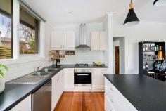  4 Geza Court Baxter VIC 3911 $620,000 - $680,000 Ideally located in the bowl of a quiet court of only a handful of homes in steps to Baxter Park and local takeaways, this three-bedroom residence offers sun-filled spaces, tidy presentation and exciting scope to modernise. This 640m2 (approx) allotment is also ready for subdivision with approved plans and permits. Set towards the front of the block with drive-through access to the rear hinting at the possibility of constructing a potential second dwelling, the property is literally footsteps to sporting fields, a short zip (or 15 minute walk) to Baxter Shopping Centre and 5 minutes' drive to Baxter Primary School and Woodleigh Senior Campus. Defined by timber flooring, light tones and radiant natural light, the residence features a warm and welcoming living area spilling into a 5 metre kitchen/meals area with island bench, gas cooktop, stainless-steel appliances, coffee station and chic subway tiling. Branching off a separate hall, the three bedrooms are serviced by a full family bathroom with shower/tub combo and a separate toilet beside the laundry, while outside the lovely garden offers ample room to relax and entertain in the sunshine, beside the firepit or beneath the covered alfresco patio. Moments to the Peninsula Link for an easy commute into Melbourne, the property includes ducted heating, a split-system, dishwasher, garden shed and plenty of paved off-street parking. 