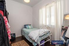  6 Russell Rd Greenmount WA 6056 $439,000 With a potential to sub divide, this Greenmount property is more than just a home. Raise a family, keep some chickens, walk the kids to school and celebrate milestones in the big backyard; this 3-bedroom home is the perfect stage for family life. The 1964-built brick and tile home has high ceilings, decorative cornicing, and timber floors throughout. Set in a friendly neighbourhood, minutes from Greenmount Primary and St Anthony’s, the home sits well back from the road behind a sweep of reticulated lawn and gardens and boasts a family-sized backyard. 3 bedrooms 1 bath 2 WC 1964-built brick and tile Open plan kitchen/meals Lounge with bay window Polished timber floors Outdoor entertaining Fully fenced backyard Single garage door 1019 sqm subdivide STA Walk schools parks bus As you step inside from the small front porch, this Greenmount home’s high ceilings and polished timber floors ensure an immediate sense of welcome. A large bay window in the lounge washes the room with natural light heightening the sense of space and highlighting the family-friendly interior layout. An open-plan kitchen/meals with an electric oven and gas hob opens to a partially enclosed verandah and sheltered patio to offer a practical indoor-outdoor layout. The outdoor living zone overlooks the generous backyard and has ample space for seating, barbecuing and dining. It provides an ideal backdrop to impromptu alfresco dinners, memorable family get-togethers and relaxed weekends reading and dozing cocooned in the green oasis of the private backyard. A central hall leads from the shared living zones to a walk-through laundry, the family bathroom and three bedrooms. Polished timber floors and high ceilings in each bedroom create a delightful sense of calm. The family bathroom has a shower, tub, vanity and WC. A second WC adjoins the laundry. The fully fenced backyard of this 1019 sqm block offers an idyllic space for kids and pets to run and play; there is even room to keep chickens, build a cubby, and plant a vegetable garden. A single garage with a paved driveway for access sits to one side of the lot. Two sheds offer storage space for garden tools and equipment. A rich and rewarding future watching your family grow, marking milestones and making memories is easy to imagine in this home and this friendly neighbourhood. 