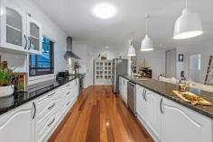  43 Finnie Rd Deagon QLD 4017 $1,200,000 This elegant contemporary home is perfectly positioned on a large 809m2 easy-care block to maximise privacy; the aspect offers effortless family-friendly living of the highest calibre within walking distance to local schools, parks, public transport, and bikeways. Across two levels, with a seamless floorplan designed to give excellent separation of living as well as wonderful light filled communal spaces. Boasting high ceilings, the luxurious galley kitchen features granite benchtops and stainless-steel appliances, including a 900mm gas cooktop, 900mm electric oven and dishwasher. Featuring a large covered entertaining deck overlooking the sparkling inground pool. Framed by delightful established gardens, with freshly mulched garden beds and luscious lawn, the outside looks just as stunning as the inside. The home comprises:  Five bedrooms  Two bathrooms  Two separate living areas  Galley kitchen  Separate laundry  Triple carport  Huge 8x4 metre powered workshop  Second garden shed  Side access  16 panel solar system  Gas hot water  Rainwater tank Located on Brisbane's northside just a short distance to the village of Sandgate, offering bars, restaurants, and miles of bicycle/walkways along the pristine shoreline looking out to Moreton Island. The area has several quality schools, both private and state, along with day-care centres close by. Deagon is ideally located to the Gateway Motorway; an easy 30-minute commute to Brisbane CBD, just 20 minutes to Brisbane Airport, and an hour drive to the Gold or Sunshine coast. 