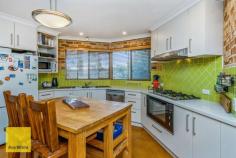  14 Rooth Road Lesmurdie WA 6076 $599,000 Conveniently located and across from the new Stirkwood Private Estate - this 3 bedroom brick and iron home built in 1985 offers a generous living space with quality fittings. 3 bedroom's and 1 bathroom, but with 2 WC's makes it ideal for growing families. There are built in robes in all the bedrooms and parquetry floors in the lounge and dining rooms, evaporative ducted air plus slow combustion heater for winter, solar hot water system and PV system (solar power) and established grounds with much money spent. Outside there is plenty of side access to the home through a double tandem carport and driving through to a large brick and iron outbuilding with electricity would make excellent vehicle storage / garage or studio or even a teen retreat. Set on an easy care 1012 sqm block and only a short stroll away from the local shops, primary and secondary schools, this home will suit a first home buyer couple, a family or those wanting to down-size or investors. 