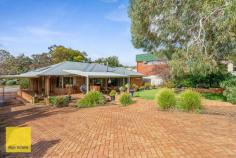  14 Rooth Road Lesmurdie WA 6076 $599,000 Conveniently located and across from the new Stirkwood Private Estate - this 3 bedroom brick and iron home built in 1985 offers a generous living space with quality fittings. 3 bedroom's and 1 bathroom, but with 2 WC's makes it ideal for growing families. There are built in robes in all the bedrooms and parquetry floors in the lounge and dining rooms, evaporative ducted air plus slow combustion heater for winter, solar hot water system and PV system (solar power) and established grounds with much money spent. Outside there is plenty of side access to the home through a double tandem carport and driving through to a large brick and iron outbuilding with electricity would make excellent vehicle storage / garage or studio or even a teen retreat. Set on an easy care 1012 sqm block and only a short stroll away from the local shops, primary and secondary schools, this home will suit a first home buyer couple, a family or those wanting to down-size or investors. 