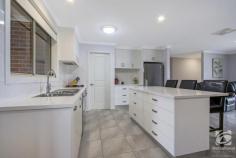  14 Gilson Place Howlong NSW 2643 $629,000 Fully furnished, only a stone's throw away from one of the region's highest-rated golf courses, this modern home offers a hole-in-one for buyers of all levels. Built by locally renowned builder Glen Hall, the home comes fully furnished, allowing you to turn the key and start living! The large master bedroom features an oversized walk-in wardrobe and ensuite with a single vanity and separate shower. The remaining three bedrooms are spacious, offering all the luxuries including built-in robes, ceiling fans and shutters. The main bathroom is positioned close to the bedrooms and is stylish with a separate bath and shower. Thoughtfully designed with family in mind, there are several private living spaces to get away and relax. The living area towards the front of the home makes the ideal space for a parents retreat or home theatre, whilst the open central living area incorporates both the kitchen and dining area. Recently updated, the kitchen maintains a practical design and layout, including stunning stone bench tops, modern appliances and more storage than you can poke a stick at, along with an oversized island bench and breakfast bar. Perfect for year-round entertaining, the alfresco area is enclosed with windows and blinds, which creates an ambience like no other. The hybrid design allows you to have a free-flowing connection from the kitchen/dining area through to the entertaining area. The large shed has been positioned perfectly for several applications, with vehicle access through the double lock-up garage and perfect side access. An enclosed walkway from the shed and garage to the home allows for easy access in comfort year-round. Other notable features of this home include solar, ducted heating and cooling, irrigation, shutters on most internal windows and established gardens. 