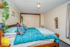  14 Rooth Road Lesmurdie WA 6076 $599,000 Conveniently located and across from the new Stirkwood Private Estate - this 3 bedroom brick and iron home built in 1985 offers a generous living space with quality fittings. 3 bedroom's and 1 bathroom, but with 2 WC's makes it ideal for growing families. There are built in robes in all the bedrooms and parquetry floors in the lounge and dining rooms, evaporative ducted air plus slow combustion heater for winter, solar hot water system and PV system (solar power) and established grounds with much money spent. Outside there is plenty of side access to the home through a double tandem carport and driving through to a large brick and iron outbuilding with electricity would make excellent vehicle storage / garage or studio or even a teen retreat. Set on an easy care 1012 sqm block and only a short stroll away from the local shops, primary and secondary schools, this home will suit a first home buyer couple, a family or those wanting to down-size or investors. 