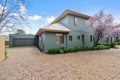  Unit 1/327 Glen Osmond Rd Glenunga SA 5064 $995,000 Tucked away in a private group with its subtle sage exterior highlighting stunning timber framed doors and windows, this late 90’s built home is in an unbeatable location. A generous formal foyer opens to an expansive family, dining and lounge area lined with north-facing windows and overlooked by a sleek neutral kitchen with wraparound breakfast bar, dishwasher, double sink, glass splash back and ample storage space. Double doors from the dining space open onto a picture-perfect and secure yard where a decent lawn area offers room for little ones to roam alongside a paved alfresco. Protected by a slanted pergola, made all the more enjoyable by borders of established trees, citrus and greenery. The first of four, a master bedroom suite is conveniently located on the ground floor, offering a walk-in robe and ensuite with shower and oversized vanity. Upstairs, bedrooms two and three are very generously proportioned with built-in robes, all bedrooms serviced by a spacious central bathroom with full-size inset bath. Delight in the details: – Zoned ducted reverse cycle air conditioning throughout – Double auto garage with internal access + extra off-street parking for up to 3 vehicles – Under stair storage – Plantation shutters + block out blinds – Large ground floor laundry with separate w/c – Freshly painted inside and out – Beautifully landscaped with a north-facing yard in an attractive group There’s no question about the location. Perfectly central to the CBD, Burnside Village, Mitcham Square Shopping Centre and at the gateway to the Adelaide Hills, you’ll be simply spoiled for choice when it comes to supermarkets, shops, private and public schools, cafes, wineries and dining out. Most importantly it is an easy walking distance to the highly desirable Glenunga International High School. 