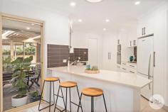  12 Beachcomber Close Anna Bay NSW 2316 Presiding over an impressive 750m2 approx. of prime real estate in a family friendly neighborhood, this sumptuous home is a celebration of modern luxury and design excellence. Meticulously presented, the focal point of the impressive family room, merging with a dining area and sublime kitchen that will provide plenty of culinary inspiration with stainless steel appliances and ample cupboard/bench space. Spilling outdoors, relax in the Queenslander room which is fully enclosed flowing through to the outdoor covered entertaining area. Accommodation comprises of 5 bedrooms all with built in robes and ceiling fan, plantation shutters and air conditioning. This is the perfect home for a retiree or a growing family. Unforgettable in every way, the finishes include new flooring and painting throughout, modern downlights, double lock up drive through garage in the backyard which offers a massive storage shed to the rear of the property. Situated just an approx. 1.4km walk to the beautiful Birubi Beach, and an approx.. 800m walk to Anna Bay Tavern and Shopping Village.  
