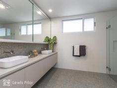  54E Cedar Avenue Brighton SA 5048 Constructed in December 2020 by multi award winning builder Cohen Developments this vibrant and sophisticated 2 bedroom townhouse has been created to stand out from the rest. Perfect for today's busy professional looking to return home to comfort and style. Those seeking a sea-change in retirement will simply love and embrace the lifestyle on offer. The ground floor is all about living with the open plan area blending seamlessly out to the rear deck which takes advantage of the northerly aspect. The outdoor deck area is protected by a louvre roof verandah with rain sensors to automatically close when required. The designer kitchen is a dream for those inclined to whip up a culinary feast for their guests. Highlighted by stone counter tops, soft close drawers, slide out pantry plus Miele appliances including dishwasher, gas cooktop and an awesome oven/microwave combo. The master bedroom has fully fitted robes and emanates the vibe of a high-end accommodation with the use of a fluted glass retractable door to create a separate dressing area with mirror and elegant lined drawers designed to store your valuable trinkets. The adjacent ensuite is a dream both in size and appointments. Fabulous floor to ceiling tiling, dual basins and masses of 'His and Hers' storage options.The second bedroom boasts real room to move and no compromise on storage once again, with full length robes. It also offers convenient access to the main bathroom that services the upstairs living area. The "X" factor here is the foam filled acoustic lined stacker door that provides the option to turn the upstairs living room into a third bedroom should a visitor stay over or just for that odd occasion. There has been great use of the natural light and ventilation from louvre styled slatted windows that are so suited to the cross flow of the coastal breezes. Externally, the home offers two undercover carpark spaces. One is a carport and the other is a lock up garage with internal access to the home via a fully sized and well-equipped laundry. Provision has been made for a lockable outside storeroom plus an alcove for your bins. 