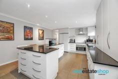  2 Jenks Pl Evatt ACT 2617 $1,295,000 This beautifully presented family home offers a spacious and flexible floor plan to accommodate growing and extended families. With 309 square metres of living, this home features 6 large bedrooms, three bathrooms and a media room. The downstairs bedroom has three way access, with a bathroom and kitchenette, ideal for a home business, separate flat or teenage retreat. Upstairs, the master bedroom is expansive with a walk in robe and ensuite, and all other bedrooms are a generous size with built in robes. The property is located in a tightly held suburb, nestled on a landscaped block with private surroundings and stunning views of the Brindabellas from the upper level. There is a family friendly backyard with a pergola, ready for summer gatherings, and a private colonial style verandah at the front – the perfect spot to relax. The two driveways are a great bonus; accommodating up to 10 cars and space for a boat, trailer or caravan. This home is conveniently positioned within walking distance to St Monica’s Primary School, Copland College, Miles Franklin Primary School and Evatt Shops and is only a short drive to the Belconnen Centre, Calvary Hospital and University of Canberra. Features: -Family friendly home with 309 square metres of living -Landscaped block with lush, established gardens -Enclosed carport, plus 2 driveways and off street parking for approx 10 cars -Media room with abundant storage- great space for a gym or extra living -Modern kitchen with fantastic storage, lots of bench space, breakfast bar and dishwasher -Spacious master bedroom with walk in robe and ensuite -Additional bedroom downstairs with ensuite, kitchenette, separate entry and storage -All other bedrooms have built in robes -Evaporative cooling -Ducted gas heating -Split system heating and cooling -Modern bathroom with separate toilet -Generous sized laundry with storage -Linen press on both levels -Walking distance to St Monica’s Primary School, Copland College, Miles Franklin Primary School and Evatt Shops 