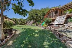  5 South Molle Boulevard Cannonvale QLD 4802 $690,000 Perched high above the ground, located in one of Cannonvale's most central neighbourhoods, sits this well-presented elevated home that gives a country feel. Enjoy convenience only a few minutes away from Whitsunday Plaza Shopping Centre. With public transport within walking distance, this property is in a prime position just a 10-minute drive from the buzz of the Airlie Beach main street. This tranquil family home has three generous bedrooms with aircon and built-in wardrobes, whilst the master bedroom has its own walk-in wardrobe, ensuite bathroom and access to the balcony. The open plan kitchen lounge area which looks onto the sizeable timber veranda creates a breezy indoor-outdoor living experience which makes entertaining guests effortless. Fully airconditioned, year-round comfort is assured. The immaculate kitchen has been recently refurbished and modernised complete with electric stove, oven and dishwasher. The block itself is 853m² and is filled with beautiful tropical gardens, which are very easy to maintain with an automatic reticulated irrigation system thoughtfully fitted throughout the front and rear of the property. Underneath the property is a double garage with side access as well as an ample space which the current owner planned to turn into another room, perfect for teenagers. 