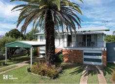  13 Thalberg Ave Biloela QLD 4715 $205,000 The view from the front balcony of this high set home is yours alone! Located on Biloela’s most sought-after Avenue, this could be just the place you have been looking for. Upstairs we have the spacious lounge and dining room, which is ‘L’ shaped and leads around to the kitchen. The kitchen has a Retro feel and is in excellent condition, you will also find ample storage cupboards. Through the extra wide hallway are 3 bedrooms, (2 of them have the fabulous view) and one bathroom with a separate toilet. Ceiling fans throughout and air conditioning in the lounge room and 2 bedrooms. The laundry is located downstairs along with a rumpus room and office space plus two lock-up garages with separate driveways and a double carport. The yard is fully fenced (front and back), with lovely shade trees including mango trees around the house. In addition. There are 3 rainwater tanks, and rainwater is plumbed into the home. Consider the Thalberg Avenue address! and a short walk to the Lions Park! Consider the opportunity to increase your living area, with all the extra space downstairs! Consider the superb view! Additional comments; Semi-furnished. 