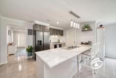  10 Water Lily Rd Bunyip VIC 3815 $740,000 - $780,000 Offered in as new condition and presented par excellence, this family sized home on a massive 701m2 allotment will impress and delight from the first look. A truly move in and spend nothing opportunity this is a home which defines the concept of low maintenance. A roll call of extras to the property includes gas fired ducted heating throughout, 2 x split system air conditioners, a mix of full block-out and standard block out blinds, sweep fans, upgraded stainless appliances, and anodised maintenance free windows, gutters and fascias. Offering three living areas – a spacious formal loungeroom, an informal living/dining area incorporating a well-planned kitchen complete with 900mm stainless steel appliances, rangehood, dishwasher, abundant cupboard and bench space plus a generously sized and fully equipped walk-in pantry. In addition, a fabulous entertainers rumpus room has sliding door access to a surprisingly spacious paved and covered outdoor living area. There is also a large sweep of lawn in the fully secure rear yard - perfect for relaxing, and with lots of playroom for children and pets. There are four double sized bedrooms, the main bedroom of especially generous proportions; complete with a full ensuite bathroom and walk in robe; the secondary bedrooms with built in robes. The family bathroom and laundry completes the design of the residence. Also, under the roofline is a genuine, oversized two car garage with concrete floor, power, double auto-tilt door, plus a single roller shutter door – ideal for access to the rear yard for a boat, caravan or trailer. There is also the security and comfort of direct to house access from the garage. Located just a stroll to the Main Street shopping, cafés, services, school/kinder, park, sporting facilities and the V-line train station, this is the perfect opportunity to not only purchase a wonderful home but also to join the friendly rural community of Bunyip. Inspect with absolute confidence. 