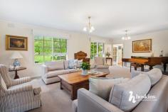  3 Tania Pl Ringwood North VIC 3134 $1,650,000 - $1,780,000 At the end of a quiet court with a beautifully landscaped front garden, this memorable Cape Cod home displays enduring elegance and a timeless design, effortlessly matched by substantial family dimensions. Flooded in light, you’re welcomed into a living room with built-in bookshelves on one side of the entry foyer and a large formal lounge and dining room on the other – both looking out onto the well-tended front garden. Step through to a generous family room, casual meals zone and a showpiece kitchen equipped with a stone breakfast bar, premium appliances and high-gloss cabinetry that provides excellent storage space. At the rear, you’ll find a large rumpus/sunroom that captures not only views of the pool but lashings of natural light as well. Take the stairs to find the spacious master bedroom with a walk-in robe and a sparkling ensuite, paired with a fitted home office, 4 additional robed bedrooms, each with a study nook and a centrally located family bathroom. Outdoors, warm summer days can be spent lazing by the pool or enjoying a meal in the pool house with family and friends, complemented by a separate home office/studio with 2 rooms and a kitchenette – a great alternative for those working remotely or running a business. Property highlights include an alarm, ducted heating, evaporative cooling, timber floors, guest powder room, water tank and a double auto garage with workshop space. A stone’s throw from Athelstane Reserve and Ringwood North Primary, and a short distance to North Ringwood Shopping Centre, bus services, Yarra Valley Grammar and Luther College, Eastland Shopping Centre, Ringwood Train Station and Eastlink for access to Melbourne CBD or the beautiful Mornington Peninsula. 