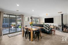  23 Whistler Concourse Bandiana VIC 3691 $715,000 ''More than meets the eye'' is thrown around too often in real estate, but this home certainly meets the criteria. The simple façade can be deceiving to the work that has been completed, and the high quality which lies through the entrance of the home. The oversized master, located at the front of the home offers a large walk-in wardrobe and ensuite that feature a separate shower and floating stone single vanity. The remaining three bedrooms offer ceiling fans, wardrobes, and carpet. These are located central to the neutral-toned, light and bright bathroom, continuing the design as the ensuite with the addition of a bath. The free-flowing floor plan offers two separate living areas, with an expansive window featured in the central living space attracting a large amount of natural light, with views of the backyard. Enjoying your drink of choice whilst watching a good movie or reading a book, the ideal place to get away and relax in private. The newly renovated kitchen has been designed to perfection with high-end appliances. The thoughtful layout, practical storage options, and corner cabinets ensure all space is used efficiently. The kitchen overlooks the main living and dining areas with the focal point being the fireplace, creating warmth and ambience second to none. Leading out from the dining area the alfresco is the ideal location for those that like to entertain, enjoying all the low-maintenance yard has to offer. Other notable features include ducted heating and cooling, rear yard access, gas hot water and a fully integrated yard. 