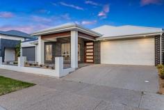  5 Webb St Lightsview SA 5085 Impeccably stylish in both feature and form, this sparkling modern family home in the heart of Lightsview is an absolute suburban stunner. Spilling with designer finishes from front to back, enter to a wide hallway where large format porcelain tiles flow past a large light-filled formal lounge and into a sprawling open-plan living and dining seamlessly extending to an all-weather alfresco for the ultimate in indoor-outdoor entertaining. The stone-wrapped chef's kitchen gleams with high gloss soft-closing cabinetry and splashback, waterfall island and breakfast bar, walk-in pantry and stainless appliances to ensure no matter if you're cooking nightly meals for the family or hosting friends for delicious dinners, you'll be doing it in stress-free style. Versatile living and thoughtful interior design are part-and-parcel of 5 Webb Street's family-friendly footprint which sees a privately positioned and generous master bedroom complete with large walk in robe and deluxe ensuite located at the front of the home, while three additional good-sized bedrooms all with built-ins and soft carpets occupy the back. The luxurious main bathroom is central to the home and features superb floor-to-ceiling tiling, separate shower and sumptuous bath as well as separate WC for extra family convenience, while ducted AC throughout keeps everyone cosy and comfortable year-round. With a wonderful lifestyle on offer, both inside and out, a property such as this beautifully positioned so close to a host of great amenities ranging from pristine leafy reserves and walk trails, local cafés for the perfect morning coffee, handy public transport to zip you into the city and just a 3-minute drive to Hillcrest Primary for quick and easy morning commutes with the kids - this stunning, feature-packed designer home promises to be the start of something special. THINGS WE LOVE • Stunning and spacious open-plan kitchen, dining and living with large formal lounge for excellent entertaining options • Gleaming designer kitchen with stone-topped waterfall island, gloss cabinetry, large WIP and stainless appliances KEY FEATURES • Decadent soft-carpeted master bedroom with generous WIR and deluxe ensuite with floor-to-ceiling tiling • 2 large bedrooms and good-sized 3rd bedroom, all with soft-carpets and BIRs • Central main bathroom featuring stylish floor-to-ceiling tiling, separate shower and relaxing bath, and separate WC • Family-friendly laundry • Ambient LED downlights and ducted AC throughout for year-round comfort • Tiled all-weather alfresco, high private fencing and neat stretches of lawn • Double garage with auto panel lift door and aggregate concrete driveway LOCATION • Close to pristine local parks and scenic walking trails • A quick 3-minutes to Hillcrest Primary and zoned for Roma Mitchell Secondary College • 5-minutes in each direction to Northgate and Greenacres shopping precincts for all your everyday needs 