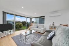 161 Tranmere Road HOWRAH TAS 7018 $1,250,000 It isn’t often homes like this become available and 161 Tranmere Road is no exception. Separated from the edge of the Derwent River only by a reserve with walking track, it’s easy to picture yourself watching the Dolphins, Whales and Seals which frolic close by. This renovated family home consists of an open plan living area which captures the wonderful views and a spacious kitchen with island bench and quality appliances. Three of the four bedrooms are located on this level, two of which have built-in wardrobes and the bathroom is stunning with feature tiles and a large shower with detachable shower head and there is a second toilet adjacent. Downstairs there is a second living area which also captures the amazing views with sliding doors to outside and an additional bedroom alongside, also with built-in wardrobes. Located on a land size of approximately 766m2, this lovely home has potential to do even more than the current Owners have done with their stylish, contemporary renovation and is close to the beach, schools and all the shopping you need plus on bus route. A fantastic opportunity awaits! 
