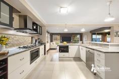  8 Classic Dr Mooroolbark VIC 3138 $1,150,000 - $1,250,000 Dazzling with its modern facade, this attractive home promises an extraordinary family lifestyle. Natural light fills the interior, introduced by a spacious lounge room with elevated garden views, leading through to a multi-purpose room that could be used as a study, playroom or additional living. Step through to an open plan family room, dining zone and a stylish kitchen appointed with stainless-steel appliances, a walk-in pantry and terrific storage space. All bedrooms are located upstairs, including the indulgently spacious master suite boasting a walk-through dressing room and a luxe ensuite with an oversized rain shower, dual basin vanity and a private Juliet balcony to unwind or read a book. A comfortable retreat enjoys peaceful Dandenong Ranges views during the day and colourful sunsets at dusk. Ready for entertaining, the paved alfresco zone with a sun awning provides a haven for casual meals outdoors, overlooking the well-maintained backyard with a lush lawn area for the kids and family pets. Amongst the highlights are ducted heating/vacuuming, evaporative cooling, quality timber floors, garden shed, water tank, dual driveway access to a double auto garage with internal access and off-street parking for visitors and friends. In a family-friendly neighbourhood, the home is positioned a short walk from Mooroolbark East Primary School and Billanook Secondary College, with proximity to Mooroolbark Village and Train Station, Box Hill TAFE Lilydale campus, Lillydale Lake and popular Shopping Centre. 