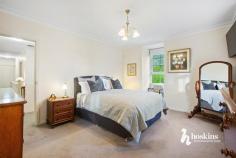  3 Tania Pl Ringwood North VIC 3134 $1,650,000 - $1,780,000 At the end of a quiet court with a beautifully landscaped front garden, this memorable Cape Cod home displays enduring elegance and a timeless design, effortlessly matched by substantial family dimensions. Flooded in light, you’re welcomed into a living room with built-in bookshelves on one side of the entry foyer and a large formal lounge and dining room on the other – both looking out onto the well-tended front garden. Step through to a generous family room, casual meals zone and a showpiece kitchen equipped with a stone breakfast bar, premium appliances and high-gloss cabinetry that provides excellent storage space. At the rear, you’ll find a large rumpus/sunroom that captures not only views of the pool but lashings of natural light as well. Take the stairs to find the spacious master bedroom with a walk-in robe and a sparkling ensuite, paired with a fitted home office, 4 additional robed bedrooms, each with a study nook and a centrally located family bathroom. Outdoors, warm summer days can be spent lazing by the pool or enjoying a meal in the pool house with family and friends, complemented by a separate home office/studio with 2 rooms and a kitchenette – a great alternative for those working remotely or running a business. Property highlights include an alarm, ducted heating, evaporative cooling, timber floors, guest powder room, water tank and a double auto garage with workshop space. A stone’s throw from Athelstane Reserve and Ringwood North Primary, and a short distance to North Ringwood Shopping Centre, bus services, Yarra Valley Grammar and Luther College, Eastland Shopping Centre, Ringwood Train Station and Eastlink for access to Melbourne CBD or the beautiful Mornington Peninsula. 