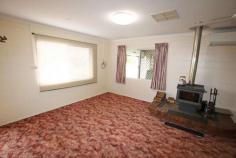  77 Newton Street Monto QLD 4630 $385,000 Lowset solid concrete block family home set in an elevated position. New colourbond roof, mobility friendly ramps and rails to both front and rear entrance, security screens to windows and doors Town water plus 20,000 litre rainwater tank with pressure pump. House can run either on town water or rainwater. Full length enclosed and screened rear patio area. Set in an elevated position on the edge of a cul-de-sac in a recent developed estate the home has a rural outlook and is just two blocks to main shopping centre of Monto. Fully air conditioned plus a slow combustion wood heater for the cooler months. Enclosed colourbond shed with electric roller door, workshop bench, vice drill stand and grinder. Carport plus internal lockup garage. Landscaped, easy-care gardens with established fruit trees and 3mt x 3mt garden shed on concrete floor. Potential to work from home plus a great place to live 