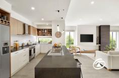  5 Observatory St Clyde North VIC 3978 $830,000-$880,000 Once serving as a Fairhaven Homes display, this spacious and contemporary build exhibits an incomparable approach to family elegance on a grand scale. Providing quality, high-end finishes throughout, from the manicured gardens through to the suspended ceiling over the dining area, this immaculate property is move-in ready. Located in a quiet street in the popular Meridian Estate, this stylish house is positioned in a family-friendly neighbourhood that includes playgrounds, bus stops, and easy access to many amenities, making it the ideal option for a busy family seeking a home that will last the distance. A neat, low-maintenance garden leads up to a large front porch and into a spacious and light entry hall. An extra-large Master bedroom with ensuite and WIR is located at the front of the home, and further down off the entry hall is access to a fabulous private lounge. The open-plan living provides a well-thought-out kitchen with S/S appliances, an array of cupboards adjoining a second living space and a meals area. A separate hallway at the rear of the home leads to three further bedrooms, all with walk-in robes; along with a family bathroom and a large laundry. Outdoors, the rear garden is perfect for entertaining with a good-sized alfresco space, easy to maintain private lawn area surrounded by an established garden and water feature. Features of note include ducted heating and cooling, double remote garage with internal access, floating floorboards and ceiling fan for the alfresco. This breathtaking showpiece of suburban living leaves all others behind with its premium blend of quality finishes. 