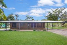  100 Bronzewing Avenue Howard Springs NT 0835 Now's the time to make that long-awaited tree change with this stunning 6.2 acre rainforest property. The three-bedroom, solid-brick homestead is perfect for the family, and there's plenty of opportunity to keep horses, pigs, chooks and other pets on this fully-equipped hobby farm with a wet season dam and reliable town water. The private, peaceful acreage is also conveniently set just seven minutes to Howard Springs village and 13 minutes to Palmerston town centre. Spacious open-plan living/dining area with exposed brick feature walls Large enclosed sunroom plus wrap-around alfresco verandah Large family-sized kitchen with under-bench oven and dishwasher Walk-in robe to master bed; built-in robes to second and third beds Child-safe in-ground saltwater pool and poolside terrace Three fenced acres with 1.8m cyclone fencing and electric gate 3.8 acres of stunning rainforest, wet season dam and dirt bike trail Reliable town water; pig pen, chook/dog run, horse paddock with stable 9m x 6m workshop, office or flat with kitchenette, ensuite and storeroom Triple plus double carports; large gravel driveway with turning circle Move straight into this solid three-bedroom home that offers low-maintenance ground-level living with a large sunroom and wrap-around verandah, and get busy setting up your new hobby farm. Or simply relax beside the in-ground pool and enjoy this peaceful rainforest setting. Enter via the wide front verandah and into the expansive open-plan living/dining area that is tiled and features glass louvre windows and exposed brick feature walls. The large adjoining kitchen will easily cater for the growing family, and the living/dining area opens into a large enclosed sunroom that serves an all-weather second living or entertaining area. There is a walk-in robe to the master bedroom that is set off the living area alongside the well-presented main bathroom with a bath, separate shower and toilet. The second and third bedrooms - both with built-in robes - are set off the dining area on the other side of the home away from the master bedroom. Outside, there's plenty of extra alfresco living/entertaining space on the wrap-around verandah with laundry facilities, and the sparkling saltwater in-ground pool is fully fenced and features a shade sail for family-friendly fun. Expansive lawns, a horse paddock with stable, a wet season dam and three acres of pristine rainforest complete this stunning rural escape. 