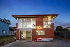  161 Tranmere Road HOWRAH TAS 7018 $1,250,000 It isn’t often homes like this become available and 161 Tranmere Road is no exception. Separated from the edge of the Derwent River only by a reserve with walking track, it’s easy to picture yourself watching the Dolphins, Whales and Seals which frolic close by. This renovated family home consists of an open plan living area which captures the wonderful views and a spacious kitchen with island bench and quality appliances. Three of the four bedrooms are located on this level, two of which have built-in wardrobes and the bathroom is stunning with feature tiles and a large shower with detachable shower head and there is a second toilet adjacent. Downstairs there is a second living area which also captures the amazing views with sliding doors to outside and an additional bedroom alongside, also with built-in wardrobes. Located on a land size of approximately 766m2, this lovely home has potential to do even more than the current Owners have done with their stylish, contemporary renovation and is close to the beach, schools and all the shopping you need plus on bus route. A fantastic opportunity awaits! 
