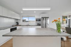  161 Tranmere Road HOWRAH TAS 7018 $1,250,000 It isn’t often homes like this become available and 161 Tranmere Road is no exception. Separated from the edge of the Derwent River only by a reserve with walking track, it’s easy to picture yourself watching the Dolphins, Whales and Seals which frolic close by. This renovated family home consists of an open plan living area which captures the wonderful views and a spacious kitchen with island bench and quality appliances. Three of the four bedrooms are located on this level, two of which have built-in wardrobes and the bathroom is stunning with feature tiles and a large shower with detachable shower head and there is a second toilet adjacent. Downstairs there is a second living area which also captures the amazing views with sliding doors to outside and an additional bedroom alongside, also with built-in wardrobes. Located on a land size of approximately 766m2, this lovely home has potential to do even more than the current Owners have done with their stylish, contemporary renovation and is close to the beach, schools and all the shopping you need plus on bus route. A fantastic opportunity awaits! 