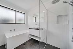  148 Heagney Crescent Chisholm ACT 2905 $839,000 Perfectly placed on a 776sqm block in the heart of Chisholm is this three bedroom two bathroom home. Beautifully renovated inside and out, this is a great find for a family or astute investor seeking a quality long-term investment. The interior features generous living areas and a stunning new kitchen with a waterfall island bench, integrated oven, induction cooktop, and superb cabinetry. Perfect for entertaining, the adjoining family room flows out to a large covered outdoor area with pull-down screens for shade and privacy, and ceiling fans and heaters for added comfort. All three bedrooms are freshly carpeted, and both the ensuite and main bathroom have been stylishly renovated with quality fixtures and fittings. Working from home will never be an issue again thanks to the detached rumpus room fitting with reverse cycle heating and cooling and cabled network port which is perfect for use as a home office or creative studio. There are an abundance of parks and playgrounds within walking distance, while Calwell shops, Erindale centre, Woden, and Tuggeranong are all just a short drive away. Features: 776sqm block Easy care gardens Living room with new carpet Beautifully renovated kitchen with stone benchtops, stunning cabinetry Central heating and cooling Family room opens to a large outdoor entertaining area Main bedroom with WIR and renovated ensuite Two additional bedrooms with built-in robes Renovated main bathroom Renovated laundry Large covered outdoor entertaining area with privacy screens, ceiling fans and heaters Grassed backyard Detached rumpus or home office with A/C and network port (approx. 25sqm) Oversized double garage with automatic roller door 