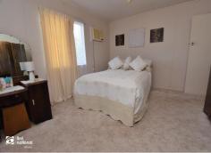  13 Thalberg Ave Biloela QLD 4715 $205,000 The view from the front balcony of this high set home is yours alone! Located on Biloela’s most sought-after Avenue, this could be just the place you have been looking for. Upstairs we have the spacious lounge and dining room, which is ‘L’ shaped and leads around to the kitchen. The kitchen has a Retro feel and is in excellent condition, you will also find ample storage cupboards. Through the extra wide hallway are 3 bedrooms, (2 of them have the fabulous view) and one bathroom with a separate toilet. Ceiling fans throughout and air conditioning in the lounge room and 2 bedrooms. The laundry is located downstairs along with a rumpus room and office space plus two lock-up garages with separate driveways and a double carport. The yard is fully fenced (front and back), with lovely shade trees including mango trees around the house. In addition. There are 3 rainwater tanks, and rainwater is plumbed into the home. Consider the Thalberg Avenue address! and a short walk to the Lions Park! Consider the opportunity to increase your living area, with all the extra space downstairs! Consider the superb view! Additional comments; Semi-furnished. 