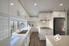  27 Ambleside Way Officer VIC 3809 $670,000 - $730,000 This stunning home on the north side of Officer is immaculately maintained and in near new condition. Offering three sizeable bedrooms, the master is accompanied by a beautifully presented ensuite and walk-in robe while the zoned secondary bedrooms boast double built-in robes and are serviced by the main bathroom and separate toilet located at the rear of the property. The entrance leads past a study nook into the heart of the home to a large open-plan living area, featuring a light filled lounge and generous meals area. The stunning hostess kitchen is an entertainers delight with stone work surfaces, a plethora of cupboards and draws and 900mm quality stainless steel appliances. Stepping outside to a private undercover alfresco area bordered by low maintenance garden and lush lawn. The creature comforts continue with ducted heating, 3 split systems, motorised window furnishings, LED lighting and a remote double garage with internal access. Close to quality schooling, including St Francis Xavier College, St Brigid’s Primary, Orchard Park Primary, amenities and parks such as Hicks Reserve its location is perfect for a wide array of purchasers. 