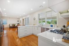  3 Tania Pl Ringwood North VIC 3134 $1,650,000 - $1,780,000 At the end of a quiet court with a beautifully landscaped front garden, this memorable Cape Cod home displays enduring elegance and a timeless design, effortlessly matched by substantial family dimensions. Flooded in light, you’re welcomed into a living room with built-in bookshelves on one side of the entry foyer and a large formal lounge and dining room on the other – both looking out onto the well-tended front garden. Step through to a generous family room, casual meals zone and a showpiece kitchen equipped with a stone breakfast bar, premium appliances and high-gloss cabinetry that provides excellent storage space. At the rear, you’ll find a large rumpus/sunroom that captures not only views of the pool but lashings of natural light as well. Take the stairs to find the spacious master bedroom with a walk-in robe and a sparkling ensuite, paired with a fitted home office, 4 additional robed bedrooms, each with a study nook and a centrally located family bathroom. Outdoors, warm summer days can be spent lazing by the pool or enjoying a meal in the pool house with family and friends, complemented by a separate home office/studio with 2 rooms and a kitchenette – a great alternative for those working remotely or running a business. Property highlights include an alarm, ducted heating, evaporative cooling, timber floors, guest powder room, water tank and a double auto garage with workshop space. A stone’s throw from Athelstane Reserve and Ringwood North Primary, and a short distance to North Ringwood Shopping Centre, bus services, Yarra Valley Grammar and Luther College, Eastland Shopping Centre, Ringwood Train Station and Eastlink for access to Melbourne CBD or the beautiful Mornington Peninsula. 