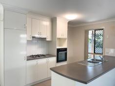  13 Peppertree Crescent Andergrove QLD 4740 Executive living on a compact, low-maintenance block offered by motivated vendors liquidating portfolio. This modern home features 4 bedrooms, main with ensuite, air conditioning and walk-in robe, the remaining 3 with fans and built-ins. Spacious, open plan living incorporates versatile dining and lounge options, all tiled and air conditioned for year-round comfort. Central kitchen with gas cooktop, rangehood, wall oven, dishwasher & breakfast bar. The family bathroom has a deep bath, corner shower and conveniently separate toilet. The laundry is adjacent and includes generous linen storage and direct access outside. With a single lock-up garage to the front and covered entertaining at the rear, the space has been well used on the 335sqm block to still allow room for a rain water tank and established trees in the private, fully fenced back yard. The benefit of cost & energy saving solar power adds to the appeal of this property. Situated in the very popular Woodlands estate, central to numerous schools, shopping options, eateries and walking distance to public transport, 13 Peppertree is an affordable offering that is not expected to last long on the market. Recently tenanted at $500/week, it has been assessed by our Property Management Team to a potential of up to $530/week for a new tenancy. 