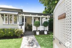  256 Verney Rd E Graceville QLD 4075 Perfectly fusing classic charm with modern functionality, this tastefully-renovated workers' cottage will capture the attention of many buyers, including those searching for a first home, couples, young families, entertainers and downsizers alike. Boasting a sparkling new magnesium swimming pool, superb entertainment options and beautiful interiors, this 1950s-built lowset dwelling is set on a private 405sqm allotment close to local conveniences and leafy parklands. It is also within the prestigious Graceville State School catchment. Thoughtfully updated while retaining the original character of the residence, this delightful cottage evokes a warm first impression with its appealing façade and covered front verandah. Set away from the street, the property is also framed by established gardens and high fences with gated archway entry. Inside, timber floors are complemented by a calming neutral colour palette. Taking inspiration from the blossoming jacaranda tree on the residence’s nature strip, ‘Jacaranda’ flows from its welcoming entry with a floral-style leadlight window to a warm and welcoming interior. Recently renovated, the property's kitchen displays crisp white cabinetry, stone benchtops, breakfast bar, walk-in pantry and quality appliances including a Bosch dishwasher and a Fisher & Paykel oven and cooktop. The floor-plan offers comfortable separation from the sleeping zone. Expect four well-sized bedrooms, including a carpeted and air-conditioned master bedroom and three additional bedrooms. A renovated main bathroom has floor-to-ceiling tiling and a separate bath and shower. Encouraging indoor-outdoor living, a covered patio seamlessly connects to an indoor/outdoor living area. Here, gather loved ones to relax with al fresco dining being the center of focus. Cook up a barbecue or unwind with a refreshing beverage. The glass-framed in-ground, magnesium swimming pool provides a tranquil backdrop for entertaining, while the fully-fenced surrounding garden features mature plantings and a children’s cubby house that is perfect for young ones and pets to enjoy. Continuing the home’s living space, the added poolside extension encompasses a generous multi-purpose area that can serve as a media room, home office or guest suite. A linked study is ideal for students or those who work from home. A second bathroom and a laundry service this extra space. The residence also includes off-street parking for one vehicle, ceiling fans throughout, excellent storage and air-conditioning across the kitchen, lounge and dining and master bedrooms. A leisurely stroll from Girraween Park’s playgrounds, local netball courts, riverside cycling routes and walking pathways, this impeccable home is also near the popular Graceville Riverside Shopping Centre's café’s, restaurants, local convenience store, bakery and Goodlife Gym. Fashionable Honour Avenue's boutiques, cafes and restaurants are a stone's throw away. The Graceville train station, Indooroopilly Shopping Centre and UQ’s Saint Lucia campus are minutes away. Falling within the Graceville State School and Corinda State High School catchment areas, this sensational property is a short drive from Christ the King Primary School, Saint Aidan’s Anglican Girls’ School and Saint Joseph’s Catholic Primary School.  