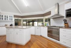  205 Hare St West Lamington WA 6430 $850,000 This modern brick & iron home boasts a formal lounge and dining room with a large open plan kitchen, family dining & living area. Generous master bedroom with WIR & ensuite shower, vanity & WC, plus 4 extra spacious bedrooms with BIRs, and a separate study with built-in desk. Neat sunny laundry room with adjoining WC. Main bathroom features a spa bath, shower & vanity and separate WC. Spacious granny flat offers open plan living with kitchenette & bathroom ideal for a guest room or indoor entertainment area. The ideas are endless … If you love entertaining, your guests will certainly relax under the large covered outdoor patio overlooking the luscious green grass and fully fenced, sparkling below ground pool. Some features include: • Granny flat with kitchenette & bathroom • Below ground pool, fully fenced • Powered 5m x 4m (approx.) garden shed with roller door • Fishpond/aviary • 3 Covered carports + extra parking • Electric gate access at front • Gas heating • Solar hot water system • 1380sqm (approx.) block 