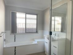  13 Peppertree Crescent Andergrove QLD 4740 Executive living on a compact, low-maintenance block offered by motivated vendors liquidating portfolio. This modern home features 4 bedrooms, main with ensuite, air conditioning and walk-in robe, the remaining 3 with fans and built-ins. Spacious, open plan living incorporates versatile dining and lounge options, all tiled and air conditioned for year-round comfort. Central kitchen with gas cooktop, rangehood, wall oven, dishwasher & breakfast bar. The family bathroom has a deep bath, corner shower and conveniently separate toilet. The laundry is adjacent and includes generous linen storage and direct access outside. With a single lock-up garage to the front and covered entertaining at the rear, the space has been well used on the 335sqm block to still allow room for a rain water tank and established trees in the private, fully fenced back yard. The benefit of cost & energy saving solar power adds to the appeal of this property. Situated in the very popular Woodlands estate, central to numerous schools, shopping options, eateries and walking distance to public transport, 13 Peppertree is an affordable offering that is not expected to last long on the market. Recently tenanted at $500/week, it has been assessed by our Property Management Team to a potential of up to $530/week for a new tenancy. 